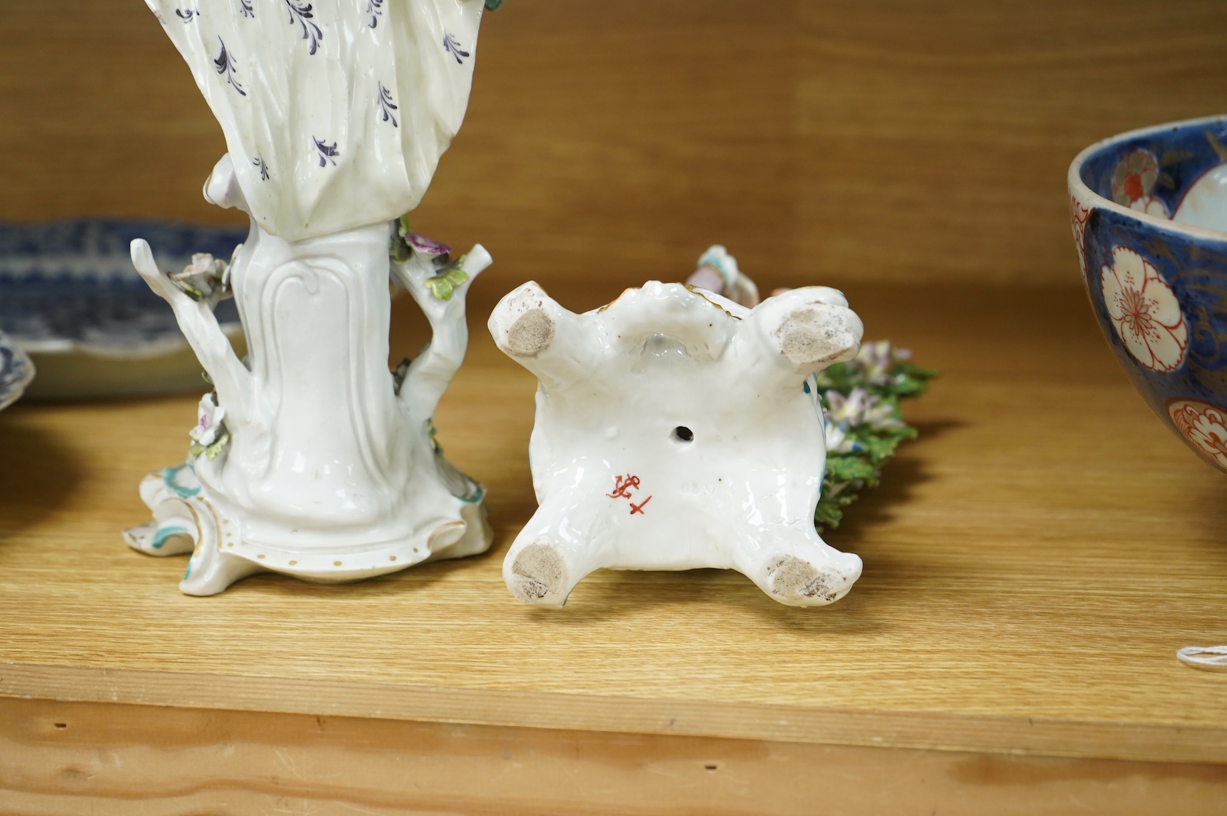 A Derby figure of a gentleman, c.1760, and a Continental porcelain figure, pseudo Bow mark, tallest 26cm high (2)